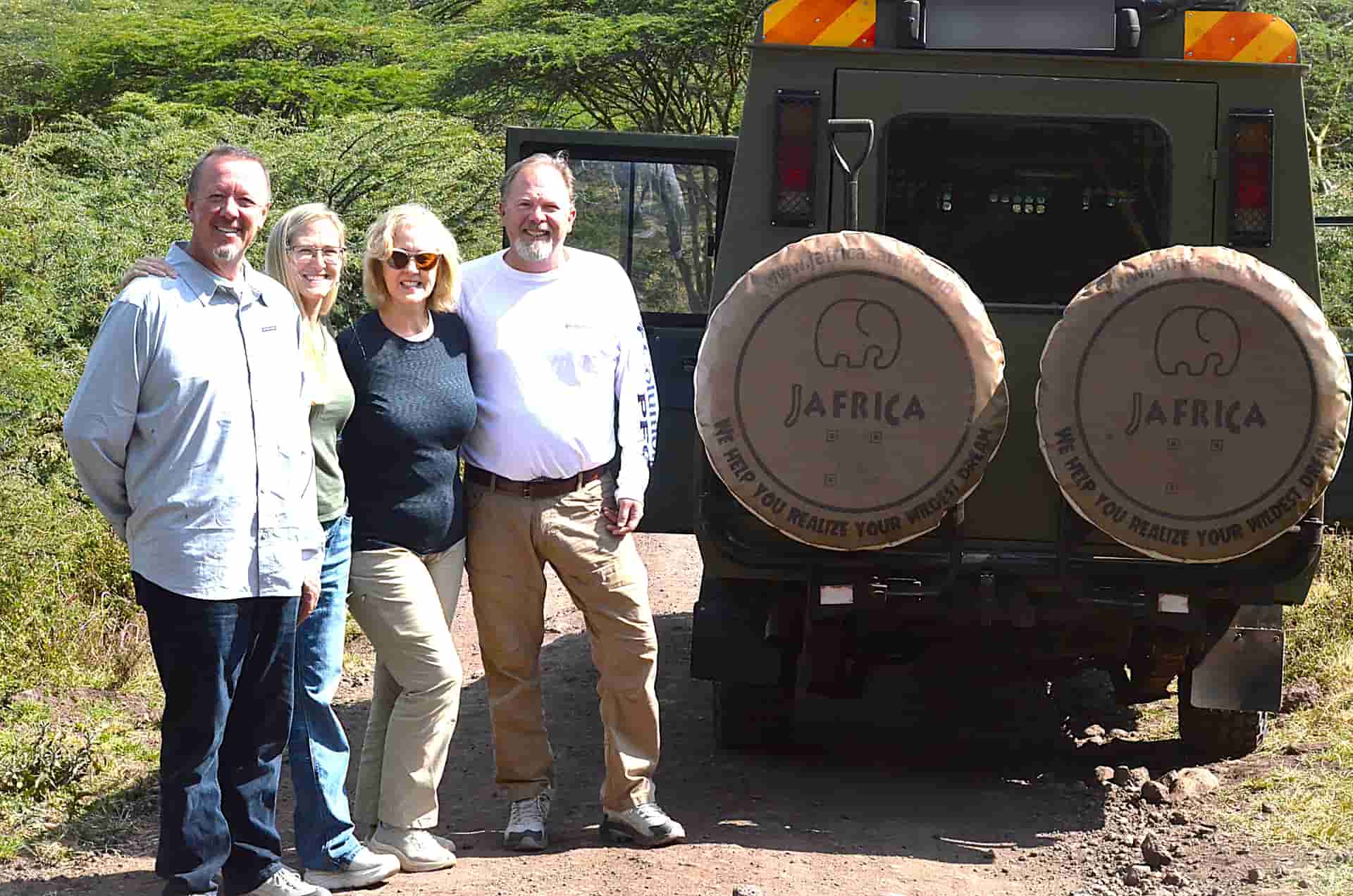 Family enjoying safari trip to Tanzania on a serengeti safari